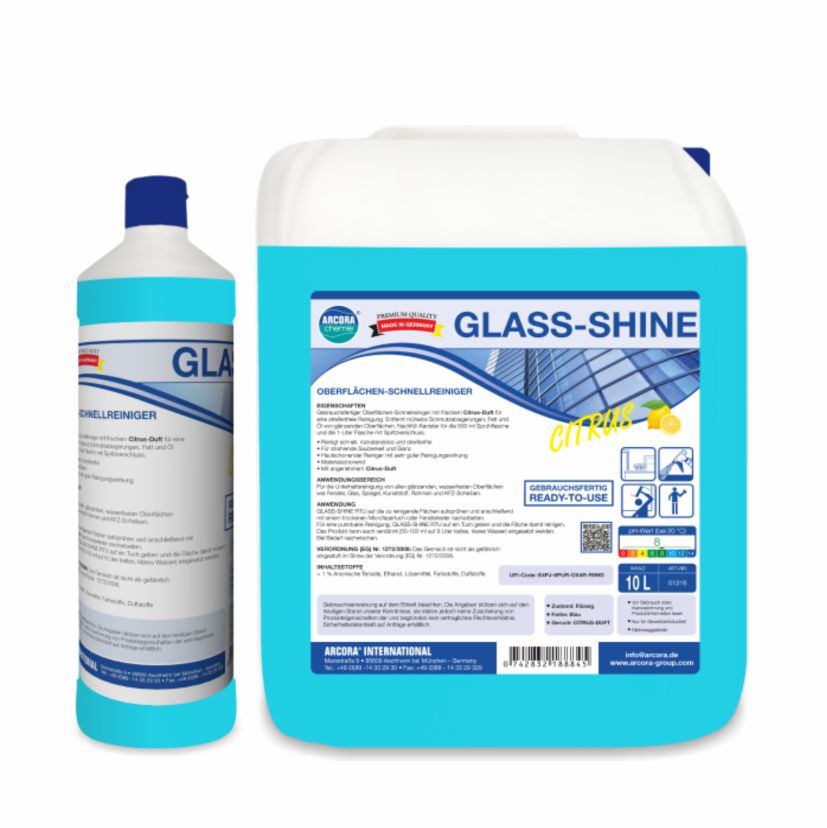 Dwa opakowania Arcora GLASS-SHINE szybkiego środka do czyszczenia powierzchni (butelka 1L i dzbanek 10L) od Arcora International GmbH. Obie etykiety zawierają informacje i wskazówki dotyczące szybkiego czyszczenia i błyszczących powierzchni.