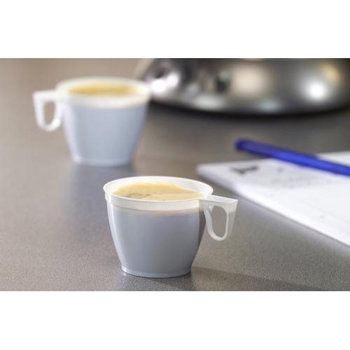 Dwie białe filiżanki Starpak 60 do kawy (0,18 l, PS, Ø 7,8 cm, 6 cm), jedna w centrum uwagi, a druga rozmyta w tle, stoją na szarej powierzchni, po prawej stronie częściowo widoczne są długopis i papier.