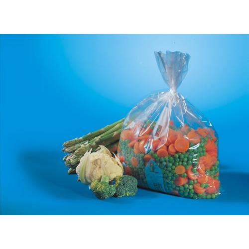 Przezroczysty woreczek do zamrażania Starpak 100 (1 l, 24 cm x 16 cm) zawiera mrożone mieszane warzywa i leży obok świeżego szparaga, kalafiora i różyczek brokuła na niebieskim tle.