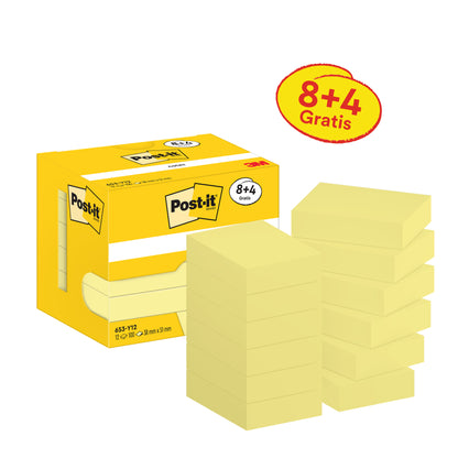 Żółte pudełko z 3M Post-it® Notes Żółty (38 mm x 51 mm, 8 bloków + 4 gratis) stoi obok dwunastu stosów notatek samoprzylepnych.