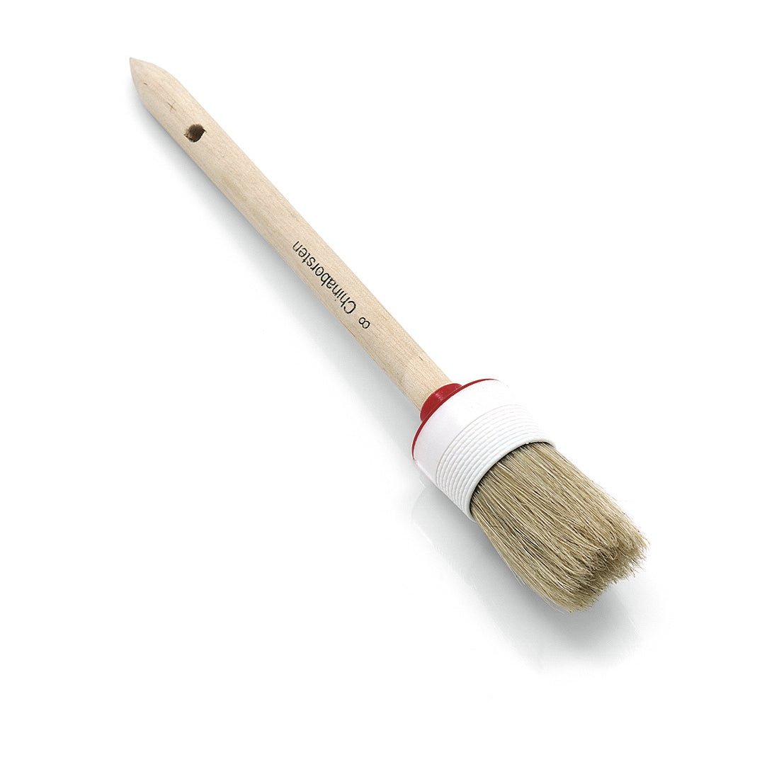 Pędzel pierścieniowy Nölle Profi Brush z jasną mieszanką włosia, plastikową oprawką, jasnym drewnianym uchwytem, czerwonym pierścieniem i otworem do zawieszenia jest przedstawiony na białym tle. Marka: Nölle Profi Brush Buersten- & Pinseltechnik e.K.