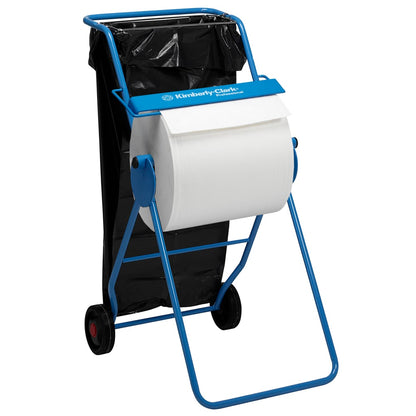 Mobilny stojak na rolki do wycierania Kimberly-Clark Professional™ (duża rolka, niebieski) od Kimberly-Clark GmbH trzyma rolkę do wycierania na poziomej wrzecionie nad workiem na śmieci. Rama nosi logo "Kimberly-Clark Professional".