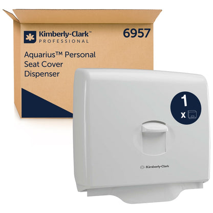 Dozownik na nakładki na sedes Kimberly-Clark GmbH Aquarius™ - Biały (1 dozownik) jest pokazany przed swoim markowym opakowaniem z numerem 6957 - idealny dla higieny w publicznych toaletach.