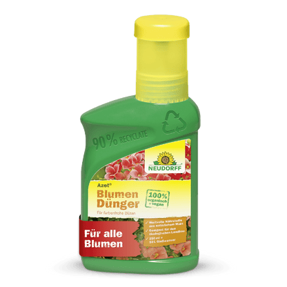 Zielono-żółta butelka Azet Nawóz do Kwiatów płynny z Neudorff Shop jest w 100% wegańska, wspiera zdrowy wzrost roślin i pokazuje różowe kwiaty oraz czerwony baner "Dla wszystkich kwiatów".