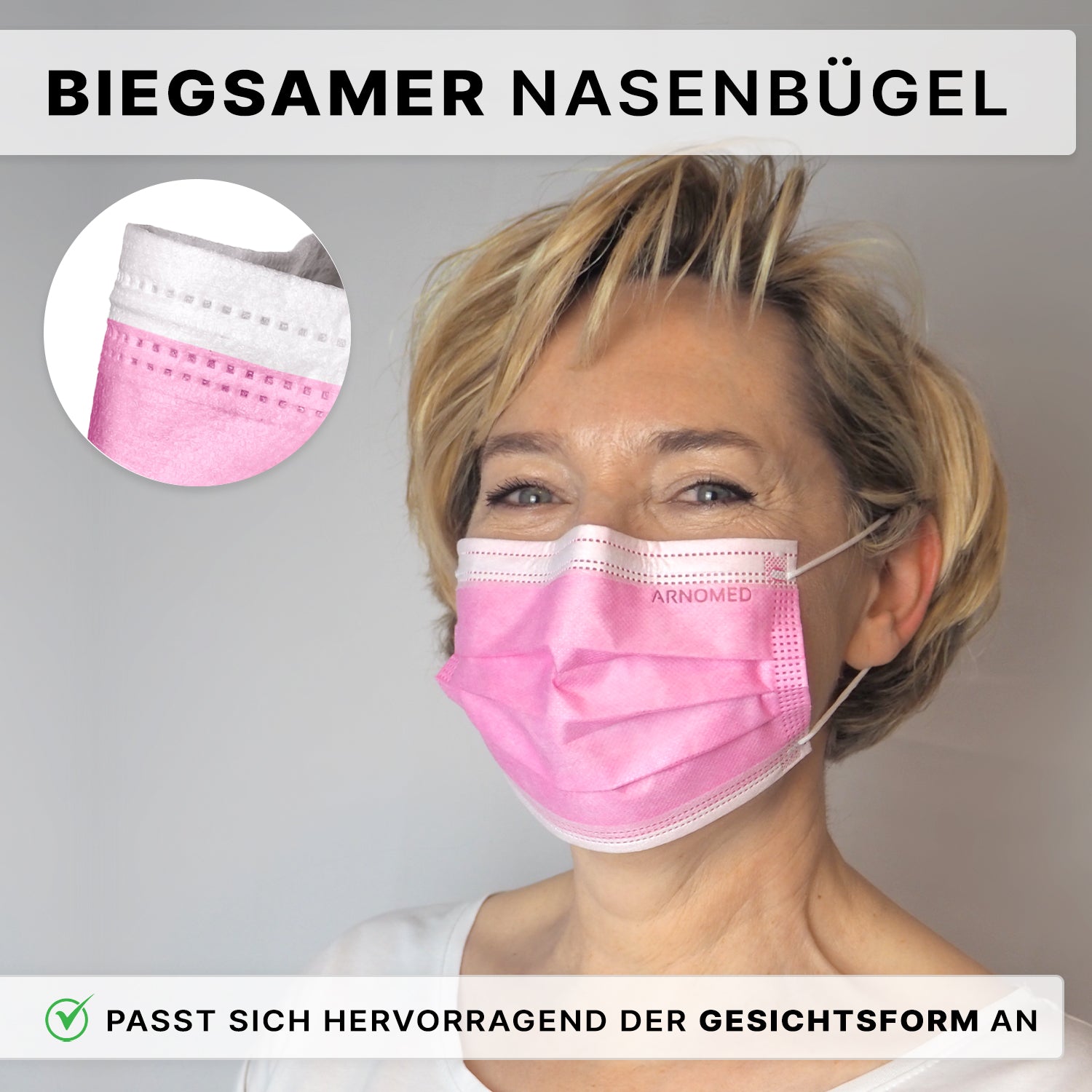 Eine Person mit kurzen blonden Haaren trägt den ARNOMED MUNDSCHUTZ TYP IIR OP-Mundschutz mit Gummibändern Typ IIR der ARNOWA GmbH in Pink, der durch seine flexible Nasenklammer und den perfekten Sitz überzeugt. Ein Einsatz hebt das Detail des Nasenbügels hervor, der deutsche Text unterstreicht die Passform.
