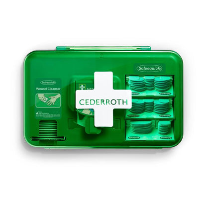 Niebieski dozownik do opatrunków Orkla Wound Care AB (1 opakowanie), zawierający produkty do opatrywania ran i materiały opatrunkowe, stoi na białym tle.