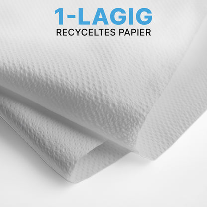 Nahaufnahme zweier weißer ARNOMED PAPIERHANDTÜCHER (25 x 23 cm, V-FALZ) der ARNOWA GmbH mit strukturierter Oberfläche, im V-Falz übereinandergelegt. Der blau-schwarze Text lautet "1-LAGIG RECYCELTES PAPIER" - ideal für Waschräume.