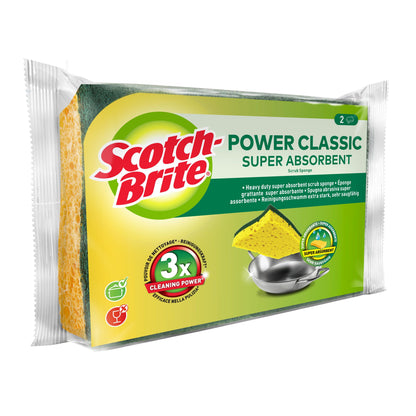 Opakowanie Scotch-Brite® Classic gąbki do czyszczenia 3M Deutschland GmbH pokazuje dwie żółto-zielone gąbki z napisem "3x siła czyszczenia" na opakowaniu i zdjęciem metalowego garnka do czyszczenia.