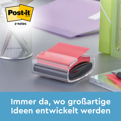 Czarny dyspenser Post-it® Z-Notes PRO z żółtymi Super Sticky Z-Notes (76x76 mm, 90 arkuszy) firmy 3M Deutschland GmbH stoi na biurku obok uchwytu na długopisy, zielonego segregatora i notatnika. Tekst: "Zawsze tam, gdzie rozwijają się wspaniałe pomysły.
