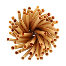 Pęczek PAPSTAR słomek koktajlowych z trzciny "pure" (15 cm, Ø 7 mm, 100 sztuk) firmy PAPSTAR GmbH jest ułożony w kształt koła na białym tle i widziany z góry.