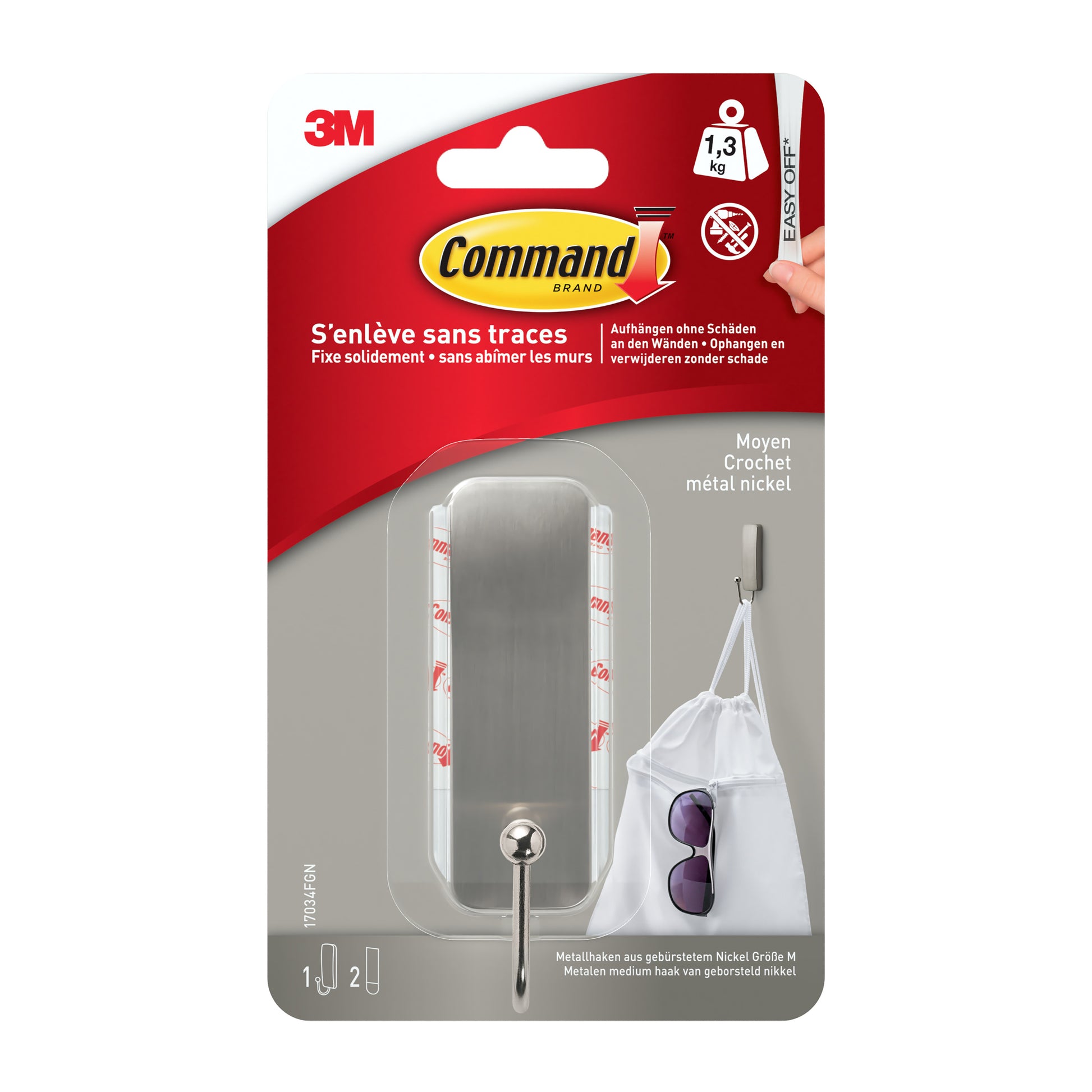 Eine Packung 3M Command™ Metallhaken medium gebürstetes Nickel (1 Haken, 2 Streifen), hält bis zu 1,3 kg; die Verpackung ist mit deutschem Text versehen und zeigt einen Metallhaken im Einsatz. Marke: 3M Deutschland GmbH.