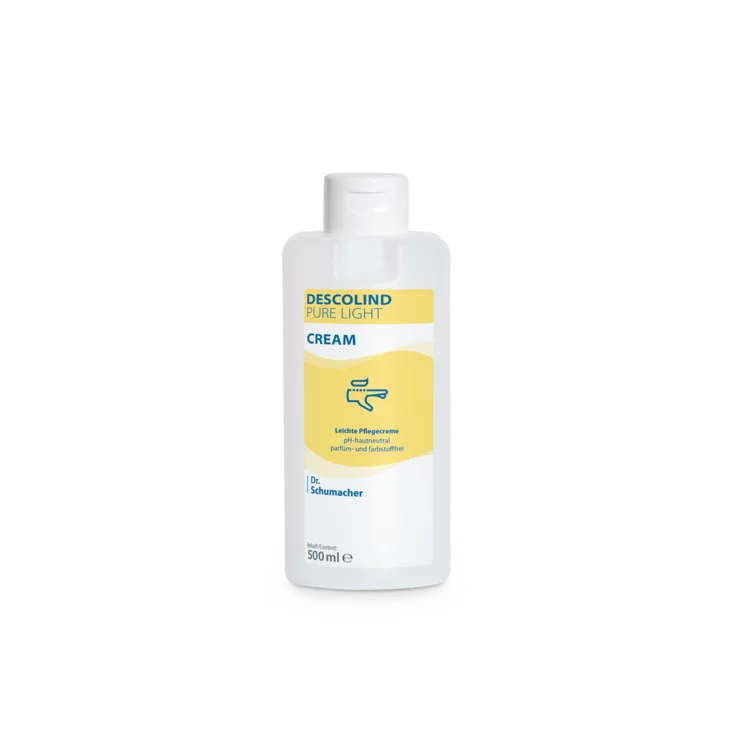 Biała plastikowa butelka 500 ml Dr. Schumacher GmbH Descolind Pure Light Cream krem pielęgnacyjny, bezzapachowy do skóry wrażliwej, ma żółtą etykietę z niebieskimi napisami i jest sfotografowana na prostym białym tle.