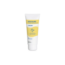 Eine 100-ml-Tube Dr. Schumacher Descolind Pure Intensivcreme der Dr. Schumacher GmbH, eine parfümfreie Intensivpflegecreme für empfindliche und trockene Haut mit gelb-weißem Etikett, steht aufrecht vor einem weißen Hintergrund.