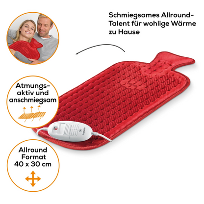 Abgebildet ist ein Beurer HK 44 Heizkissen der Beurer GmbH mit strukturierter Oberfläche und elektrischer Steuerung. Ein Paar entspannt zusammen und hält das Heizkissen in den Händen. Der Text in Deutsch hebt die Eigenschaften hervor: atmungsaktives Material, gute Passform, 3 Temperaturstufen und Allround-Format von 40x30 cm.