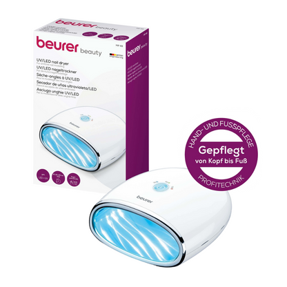 Produkt wycofany Beurer MP 48 LED/UV-Suszarka do paznokci od Beurer GmbH stoi obok swojego opakowania. Lampa do paznokci nadaje się do pielęgnacji rąk i stóp oraz modelowania sztucznych paznokci. Na pudełku znajdują się szczegóły i branding w języku niemieckim.