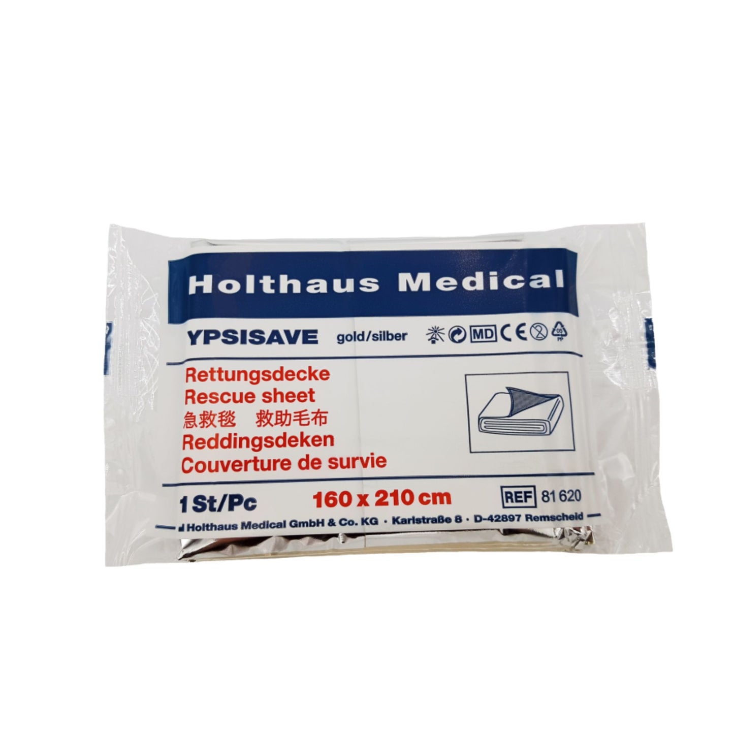 Opakowanie koca ratunkowego Holthaus Medical YPSISAVE złoto/srebrnego (160 x 210 cm) zapewnia ochronę przed zimnem, jest opisane w wielu językach i wyraźnie nosi nazwę marki Holthaus Medical GmbH & Co. KG oraz numer referencyjny 61620.