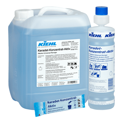 Dwa opakowania (10-litrowy kanister i mniejsza butelka) oraz niebieski worek jednorazowy Kiehl Keradet-Aktiv Alkohol-Universal-Reiniger firmy Johannes Kiehl KG, z niemiecką etykietą i odpowiednie do wszystkich powierzchni.