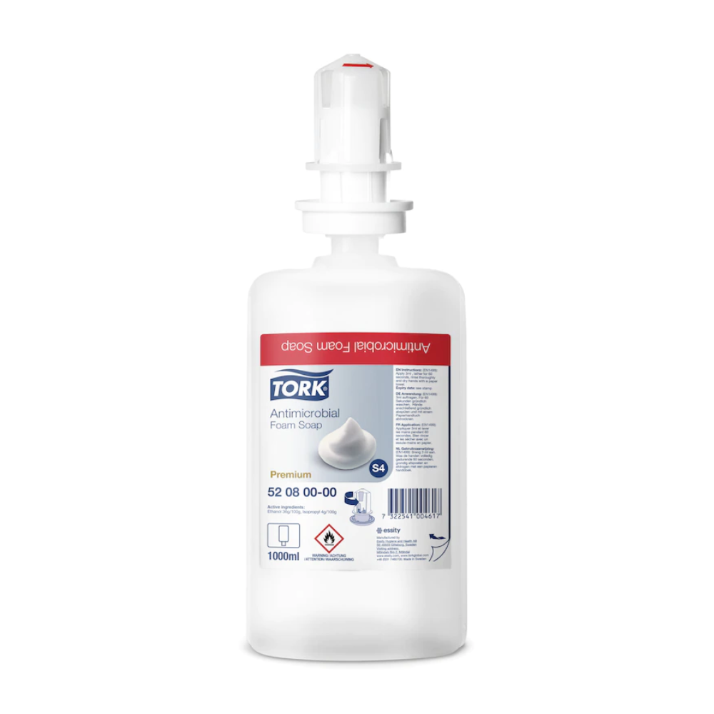 Eine 1000 ml Tork 520800 Schaumseife zur Händedekontamination Premium S4 Flasche von TORK - Essity Professional Hygiene Germany GmbH, mit weißem Spenderkopf und rotem Etikett. EN 1499 zertifiziert, ideal für effektive Händedekontamination.