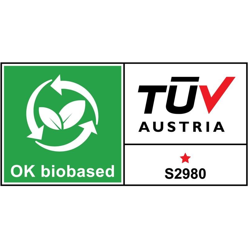 Etykieta "OK biobased" pokazuje zielone liście, okrągłe strzałki i sekcję TÜV AUSTRIA z czerwoną gwiazdą i kodem S2980 - idealna dla ekologicznych produktów takich jak podajnik stołowy Scotch™ w kształcie kota C39 + taśma Magic™ od 3M Deutschland GmbH.