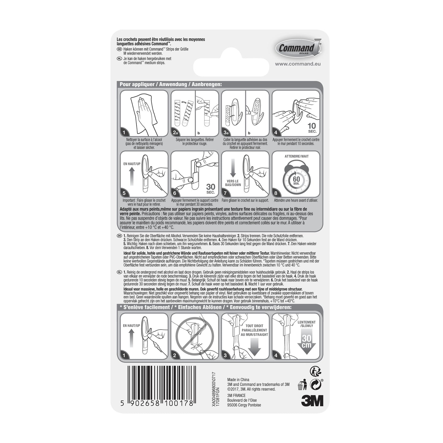 Rückseite einer Command™ Medium Designer-Haken, 17081-FGN-Verpackung der 3M Deutschland GmbH mit bebilderter Schritt-für-Schritt-Klebestreifen-Anleitung, mehrsprachigem Text, 3M-Logo, Website, Barcode und einem Tipp zur Haushaltsorganisation (Haken Aufbewahrung).