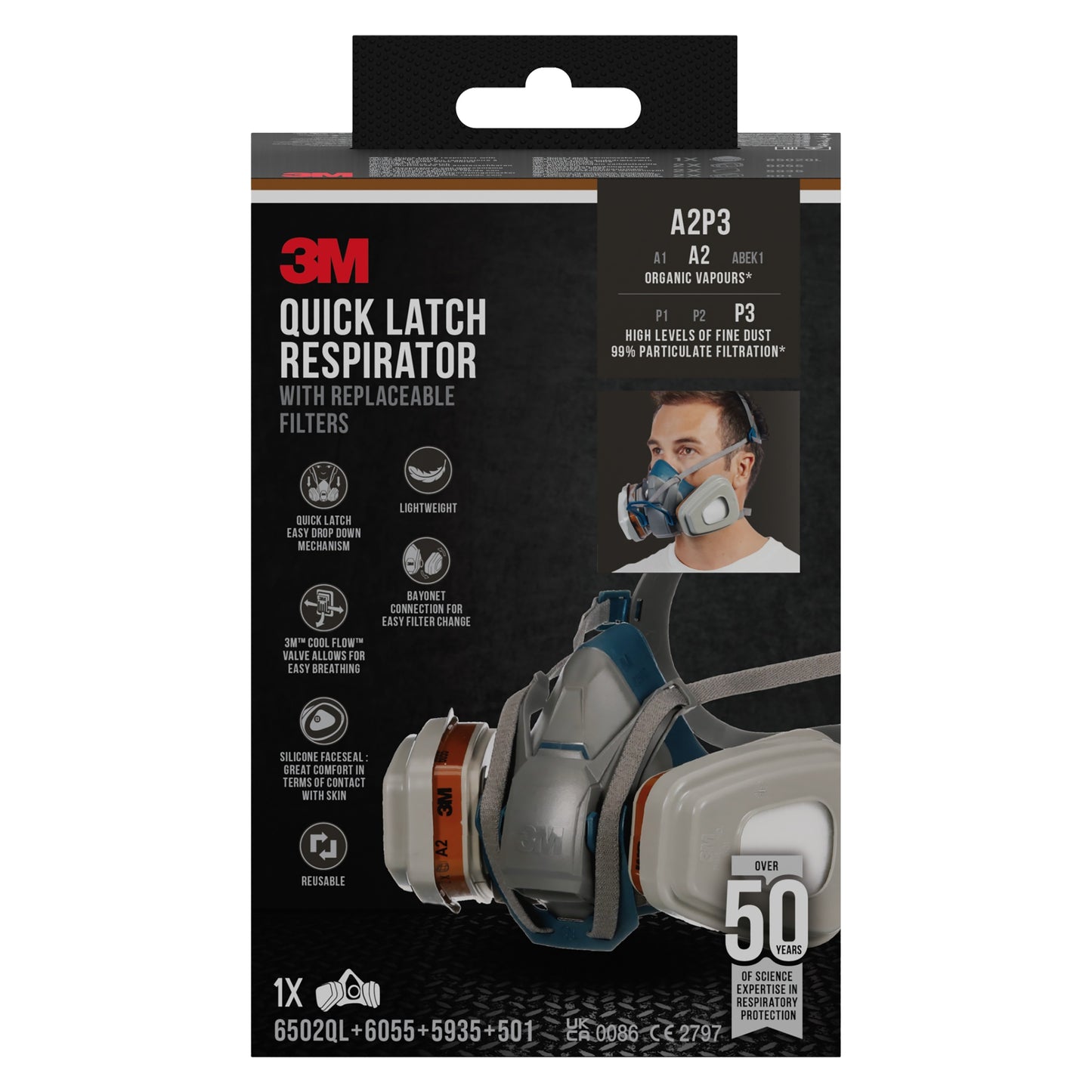 Ilustracja pokazuje pudełko maski ochronnej 3M™ Quick Latch 6502QLKIT-1 firmy 3M Deutschland GmbH z wymiennymi filtrami A2P3 do oparów organicznych; zawiera 1 maskę, 2x6055, 2x5935, 2x501. Opakowanie pokazuje zdjęcia produktu i szczegóły.