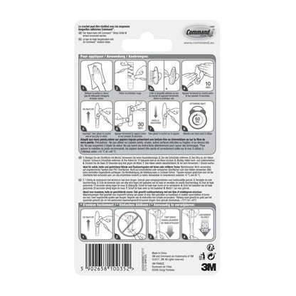 Tył opakowania metalowych haków Command™ "klasycznych" (3M Deutschland GmbH) z ilustrowaną, wielojęzyczną instrukcją użycia i usuwania oraz kodem kreskowym na dole.
