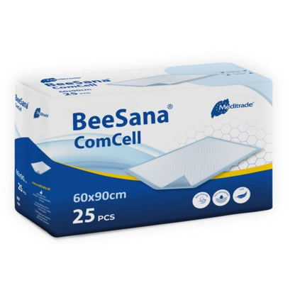 Obraz przedstawia prostokątne opakowanie podkładki BeeSana® ComCell firmy Meditrade GmbH. Biało-niebieskie pudełko ma wymiary 60x90 cm, zawiera 25 sztuk i jest wykonane z chłonnego papieru celulozowego.