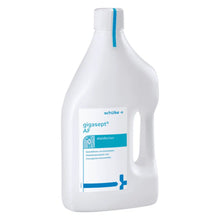 Butelka Schülke gigasept® instru AF dezynfekcji instrumentów (bez aldehydów) firmy Schülke & Mayr GmbH, biała z niebieskimi akcentami, do dezynfekcji instrumentów medycznych, w tym endoskopów. Etykieta zawiera tekst i krzyż medyczny.